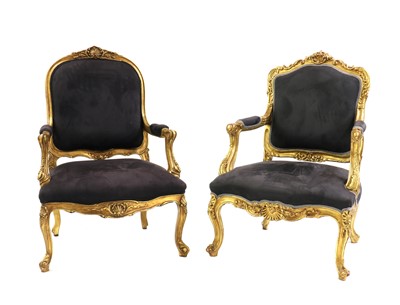 Lot 446 - A near pair of giltwood armchairs