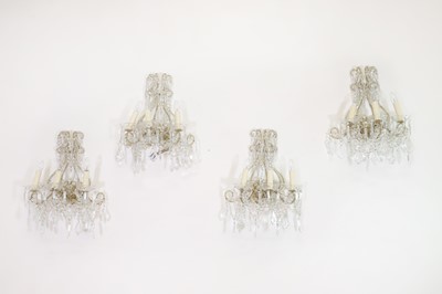 Lot 388 - A set of four gilt-metal and glass wall sconces