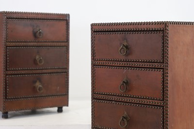 Lot 225 - A pair of studded leather bedside chests