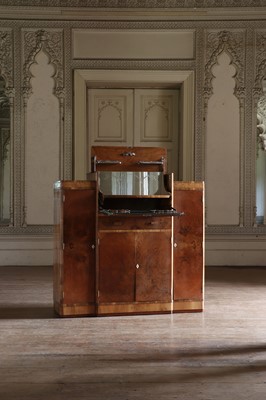 Lot 204 - An Art Deco walnut crossbanded breakfront cocktail cabinet