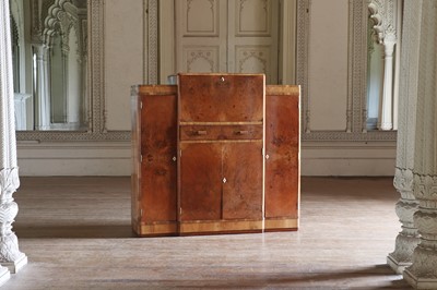 Lot 204 - An Art Deco walnut crossbanded breakfront cocktail cabinet