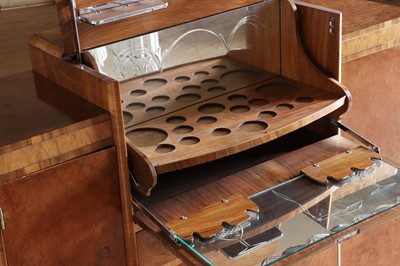 Lot 204 - An Art Deco walnut crossbanded breakfront cocktail cabinet