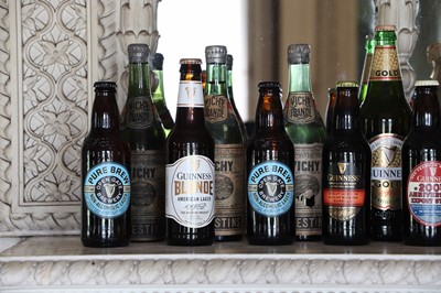 Lot 198 - A collection of nine commemorative Guinness bottles