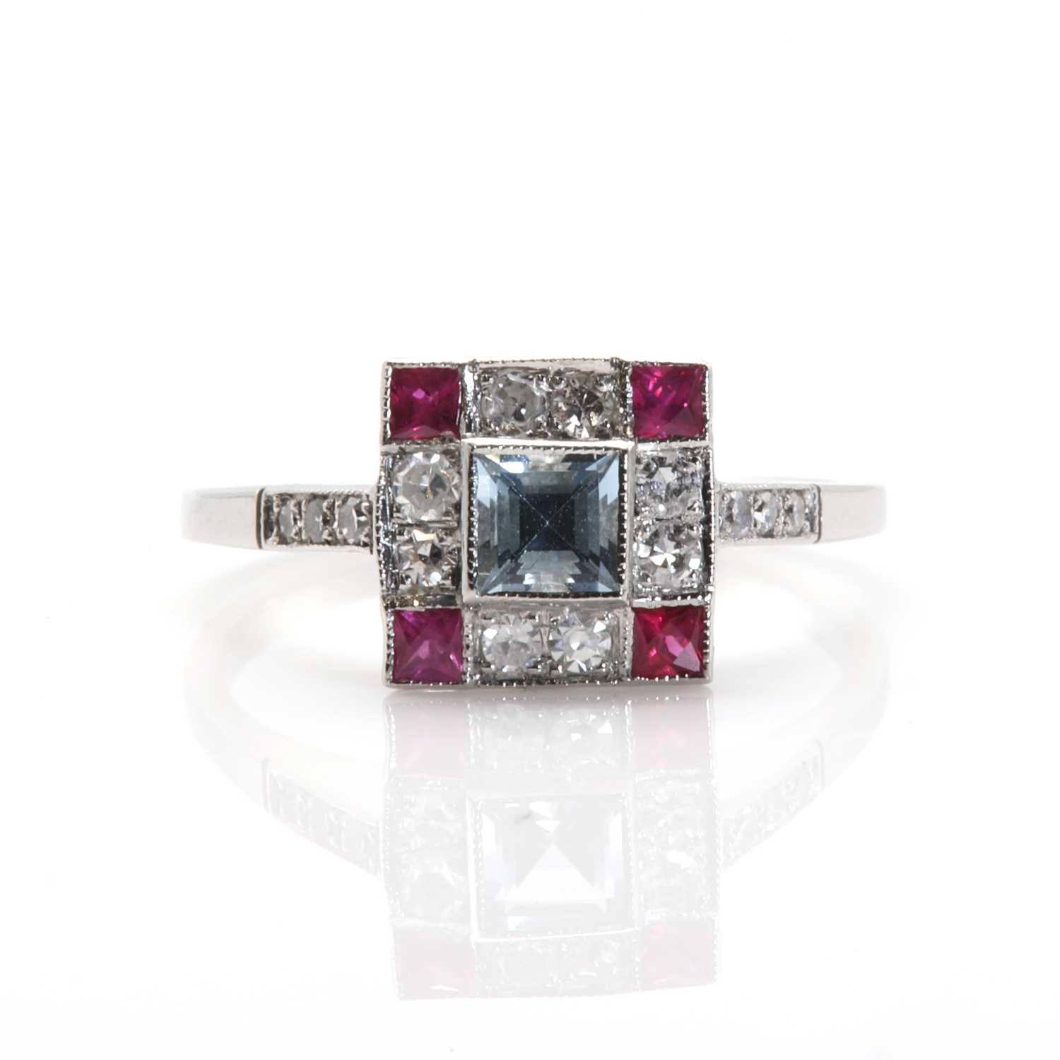 Lot 70 - An Art Deco style aquamarine, ruby and diamond square cluster ring