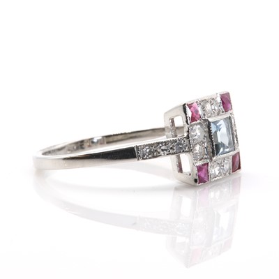 Lot 70 - An Art Deco style aquamarine, ruby and diamond square cluster ring