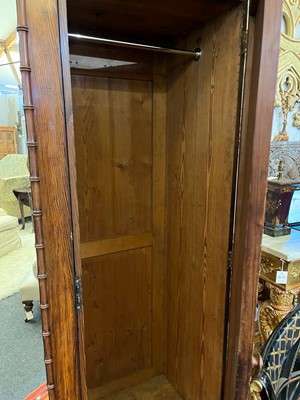 Lot 400 - A late Victorian pitch pine wardrobe by Howard & Sons