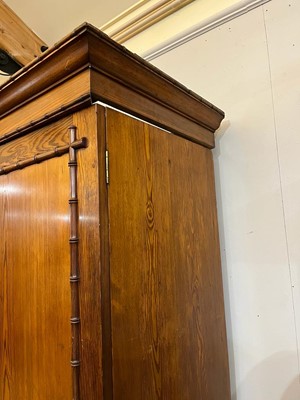 Lot 400 - A late Victorian pitch pine wardrobe by Howard & Sons