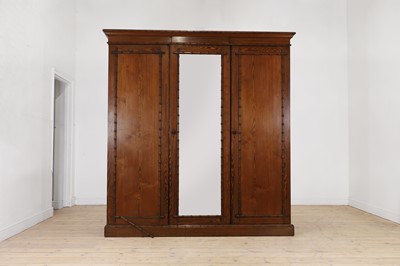 Lot 400 - A late Victorian pitch pine wardrobe by Howard & Sons