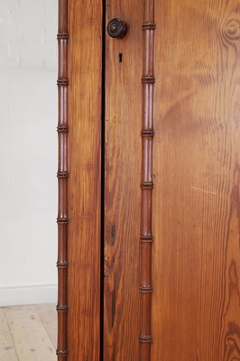 Lot 400 - A late Victorian pitch pine wardrobe by Howard & Sons