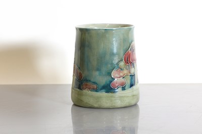Lot 68 - A Liberty & Co. Moorcroft 'Claremont' pottery christening mug