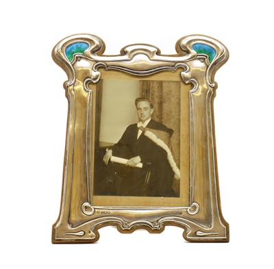 Lot 102 - An Art Nouveau silver and enamelled photograph frame