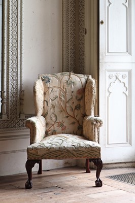 Lot 108 - A George III-style mahogany-framed wingback armchair
