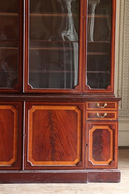 Lot 208 - ☘ A mahogany and satinwood breakfront library bookcase