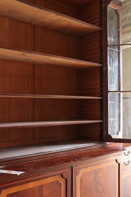 Lot 208 - ☘ A mahogany and satinwood breakfront library bookcase