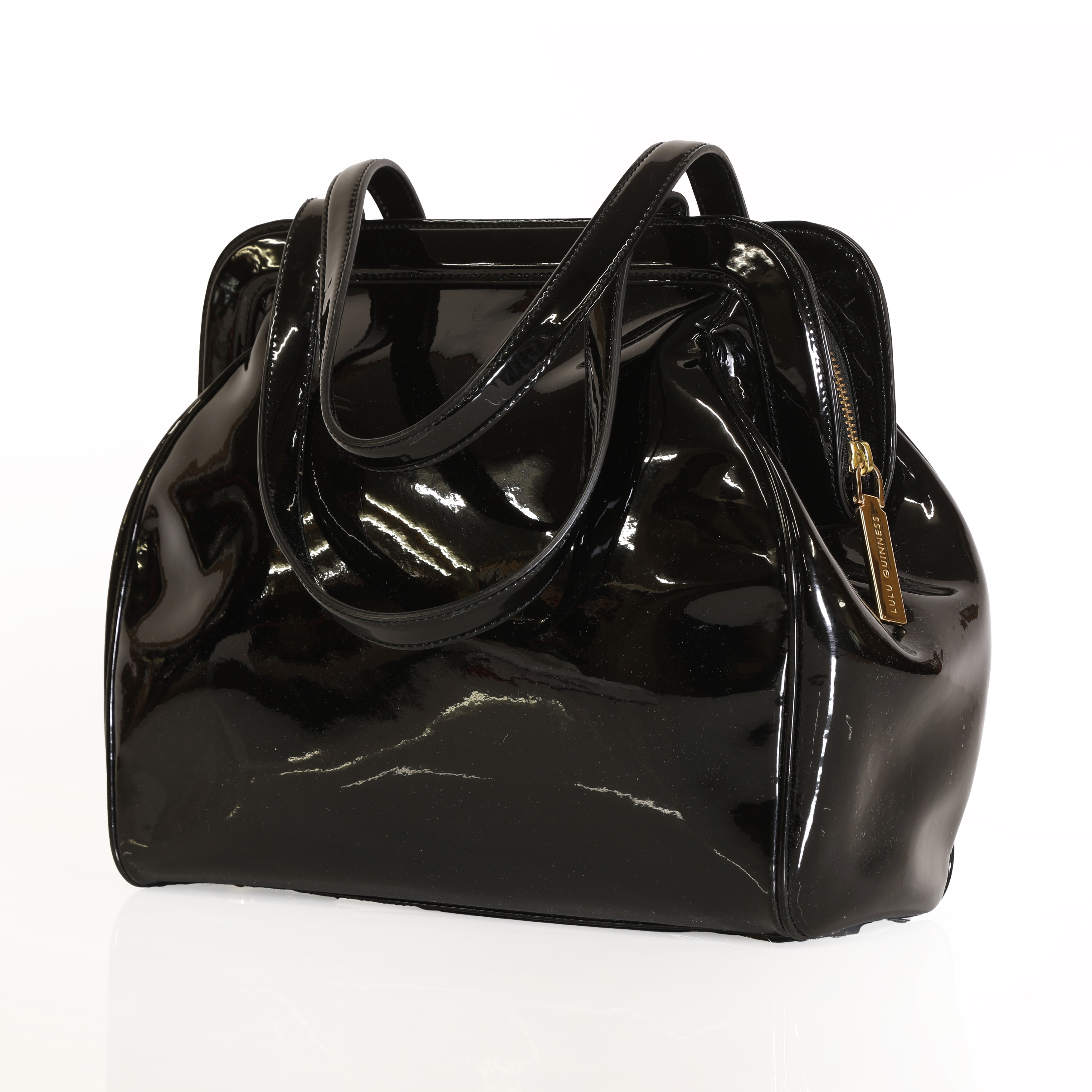 Lot 325 - A black patent leather Lulu Guinness bag,