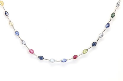 Lot 186 - A multicolour sapphire and ruby long chain necklace