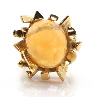 Lot 120 - An abstract design fire opal ring