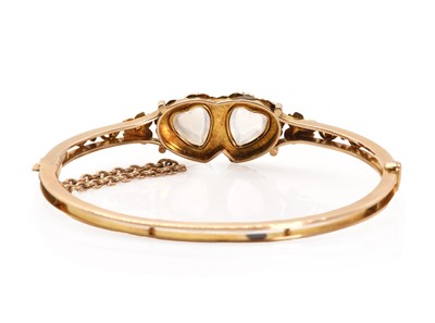 Lot 10 - A Victorian double heart moonstone and seed pearl bangle