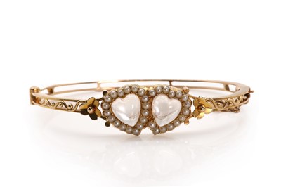 Lot 10 - A Victorian double heart moonstone and seed pearl bangle