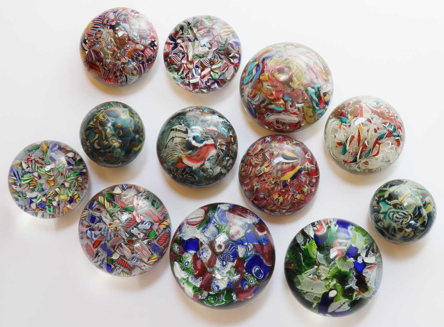 200 - A group of scramble glass paperweights,