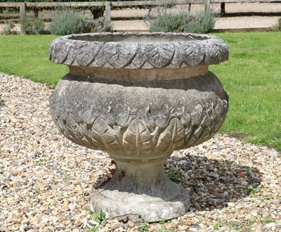 Lot 522 - A reconstituted stone urn