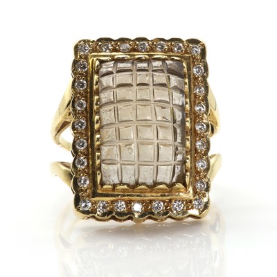 Lot 261 - A carved smoky quartz and diamond cluster ring