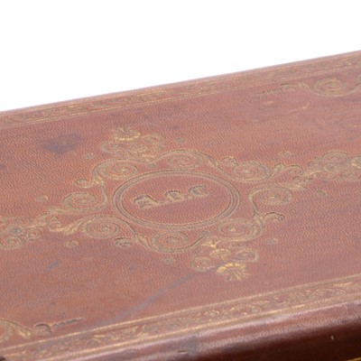 Lot 181 - A Victorian embossed leather jewellery box containing a collection of jewellery