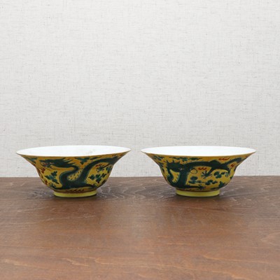 Lot 70 - A pair of Chinese yellow-ground green-enamelled bowls