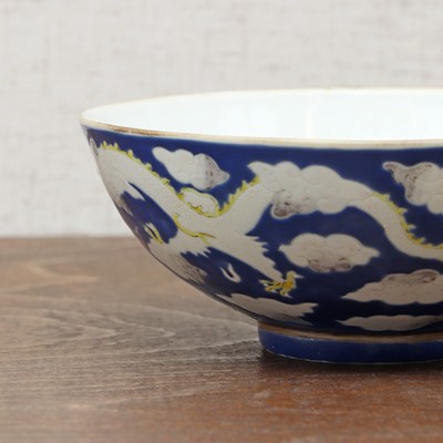 Lot 71 - Three Chinese blue-ground white-enamelled bowls