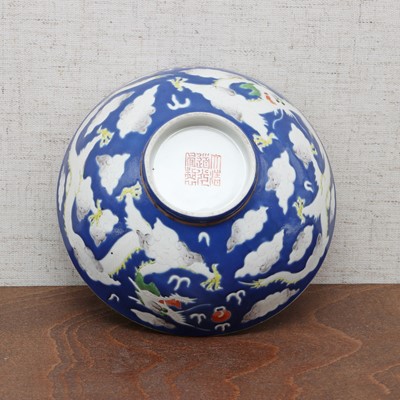 Lot 71 - Three Chinese blue-ground white-enamelled bowls