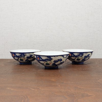 Lot 71 - Three Chinese blue-ground white-enamelled bowls