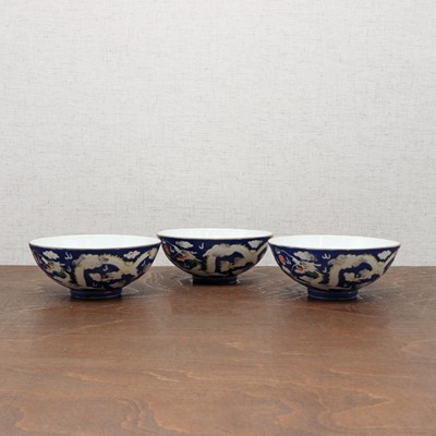 Lot 71 - Three Chinese blue-ground white-enamelled bowls