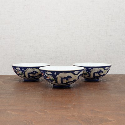 Lot 71 - Three Chinese blue-ground white-enamelled bowls