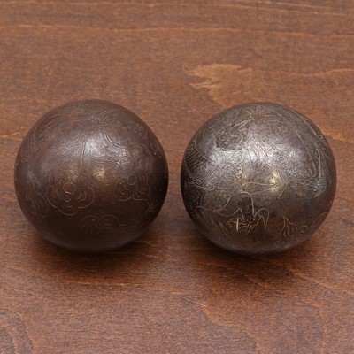 Lot 92 - A pair of Chinese iron baoding balls