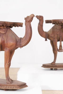 Lot 80 - A near pair of teak camel occasional tables