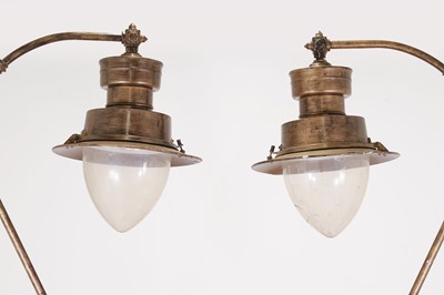 Lot 130 - A pair of large painted metal lamps