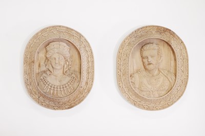 Lot 127 - A pair of carved and painted softwood plaques