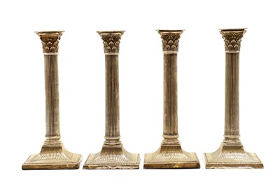 Lot 42 - A set of four silver candlesticks