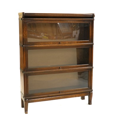 Lot 415 - A three section oak Globe Wernicke bookcase