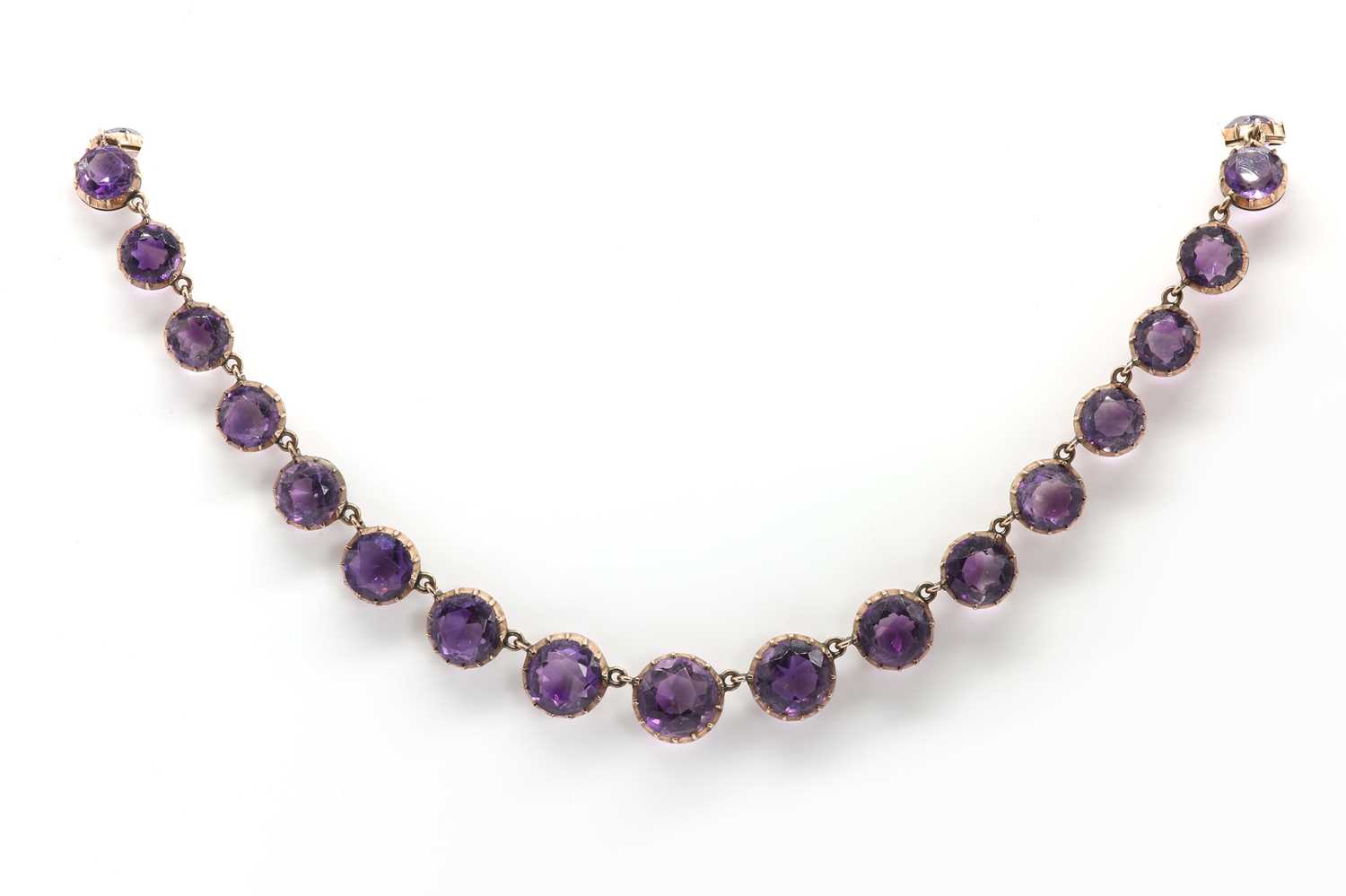 Lot 16 - A Victorian gold graduated amethyst rivière necklace