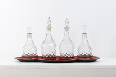 Lot 265 - A Regency toleware tray and a set of glass decanters