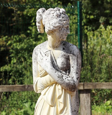 Lot 493 - A composite stone garden statue of a classical maiden