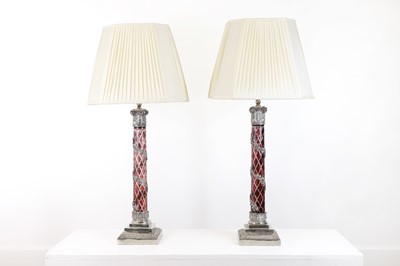Lot 197 - A pair of red glass and metal-mounted column lamps