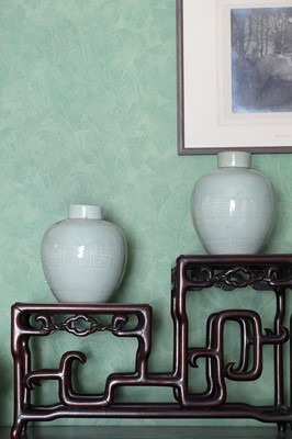 Lot 168 - A pair of Chinese celadon jars and covers