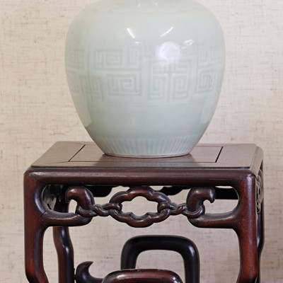 Lot 168 - A pair of Chinese celadon jars and covers