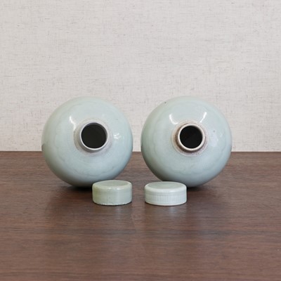 Lot 168 - A pair of Chinese celadon jars and covers