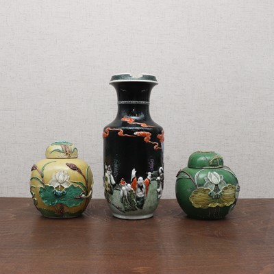 Lot 196 - A pair of Chinese carved porcelain jars and covers