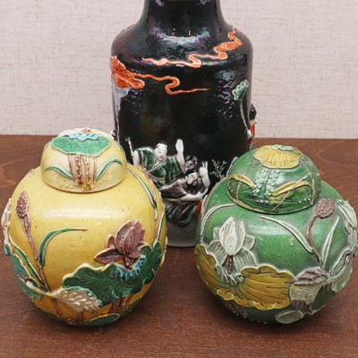 Lot 196 - A pair of Chinese carved porcelain jars and covers