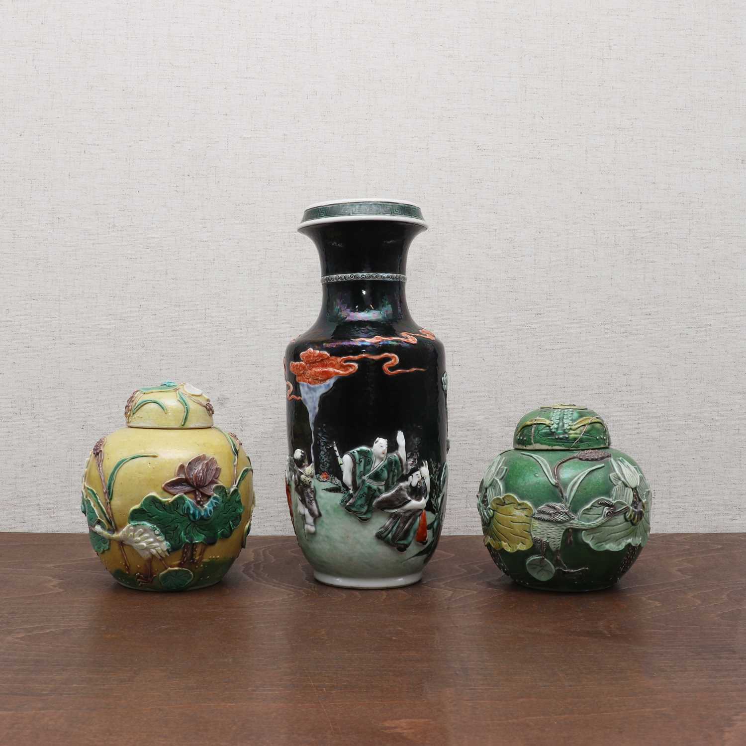 Lot 196 - A pair of Chinese carved porcelain jars and covers