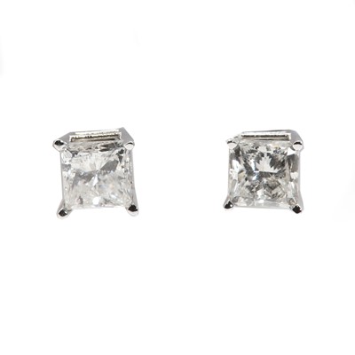 Lot 112 - A pair of white gold diamond stud earrings